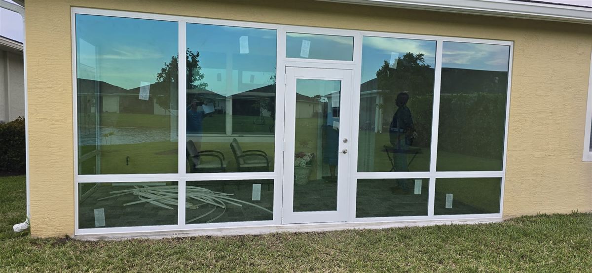 Full lanai enclosure with new impact glass installed by GRV