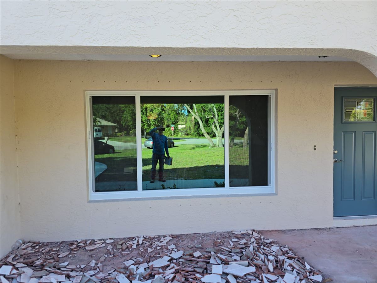 Interior finish work near newly installed windows in a Vero Beach home