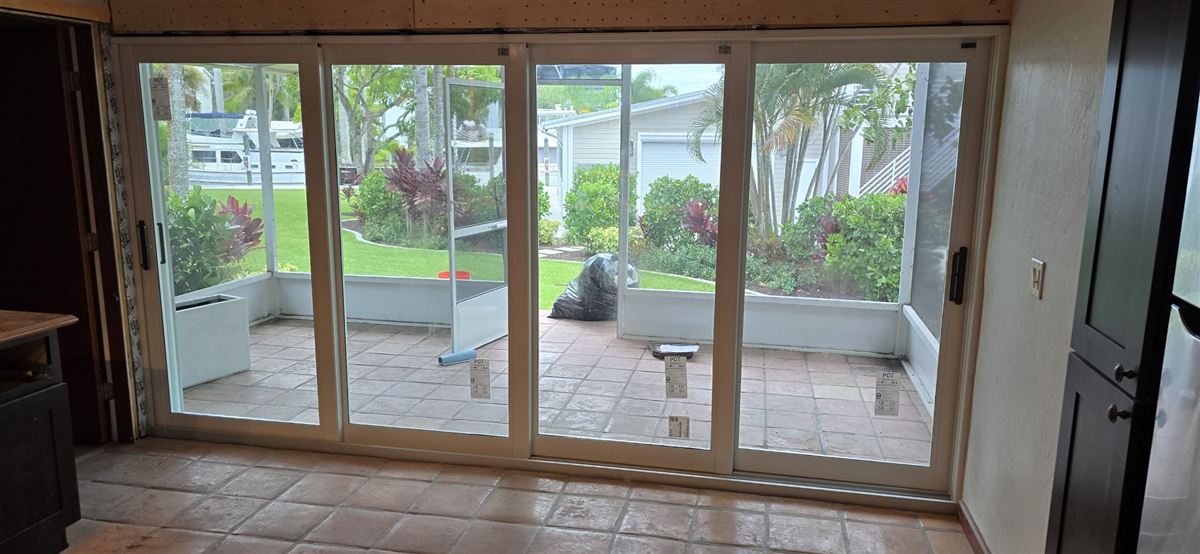 Sliding glass door installation on a waterfront Vero Beach home